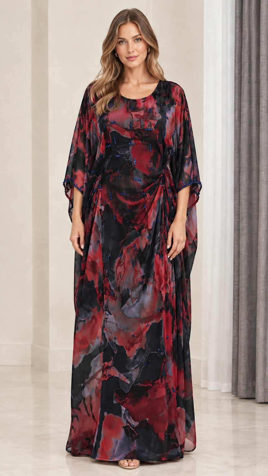 Front view of model wearing black multi floral watercolor draped kaftan maxi dress