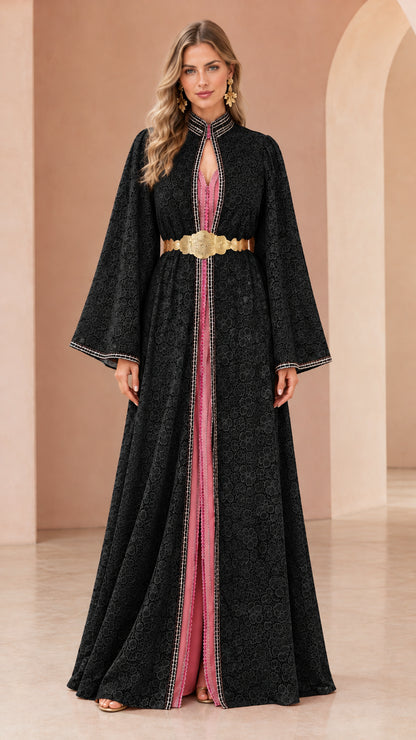 Woman wearing black floral lace kaftan maxi dress with gold belt