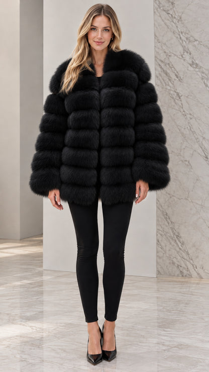 Front view of model wearing black striped faux fur mid-length jacket