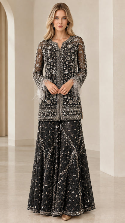 Model wearing black embellished tunic and flared palazzo pant set
