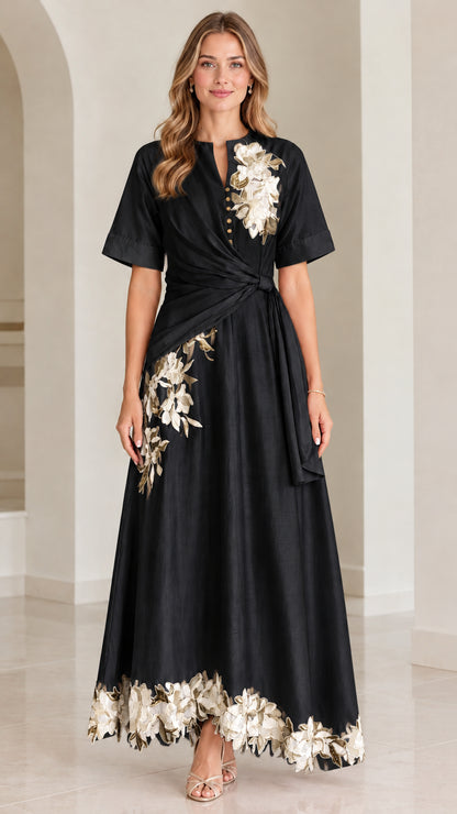 Front view of black floral embroidered twist-waist maxi dress
