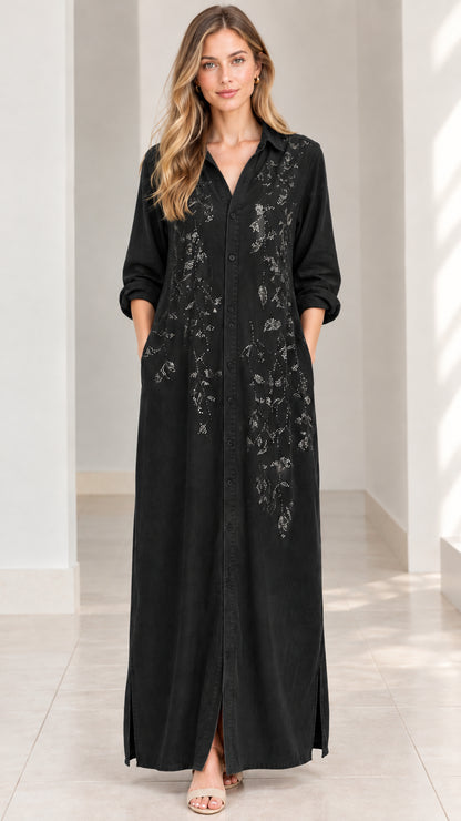 Front view of woman wearing black embroidered maxi shirt dress