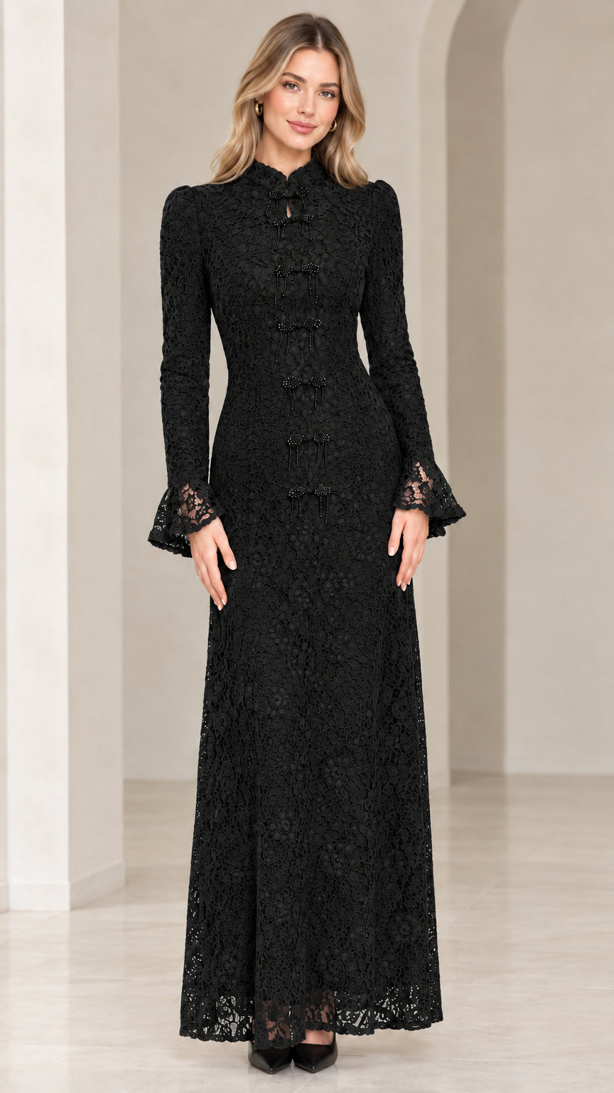 Front view of model wearing black floral lace maxi evening gown
