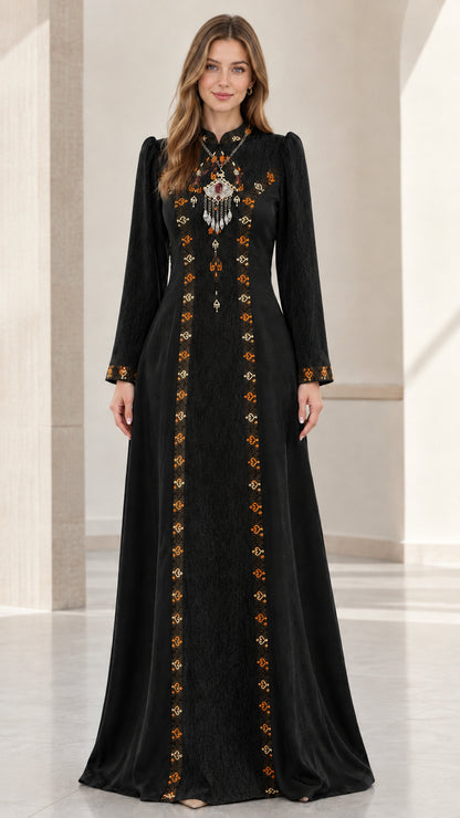 Front full-length view of woman wearing black embroidered long sleeve maxi dress