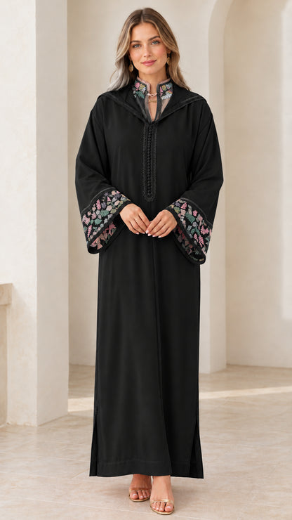 Model wearing black embroidered hooded djellaba maxi dress