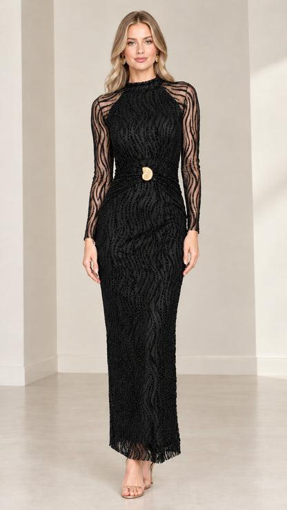 Front view of model wearing black embellished long sleeve maxi dress