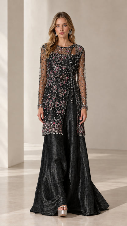 Model wearing black embellished cutout tunic and wide-leg pant formal set