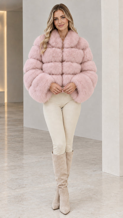 Model wearing soft pink cropped tiered faux fur jacket