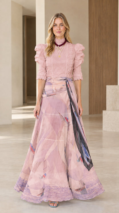 Full-length view of dusty pink mock neck puff sleeve top with matching watercolor maxi skirt