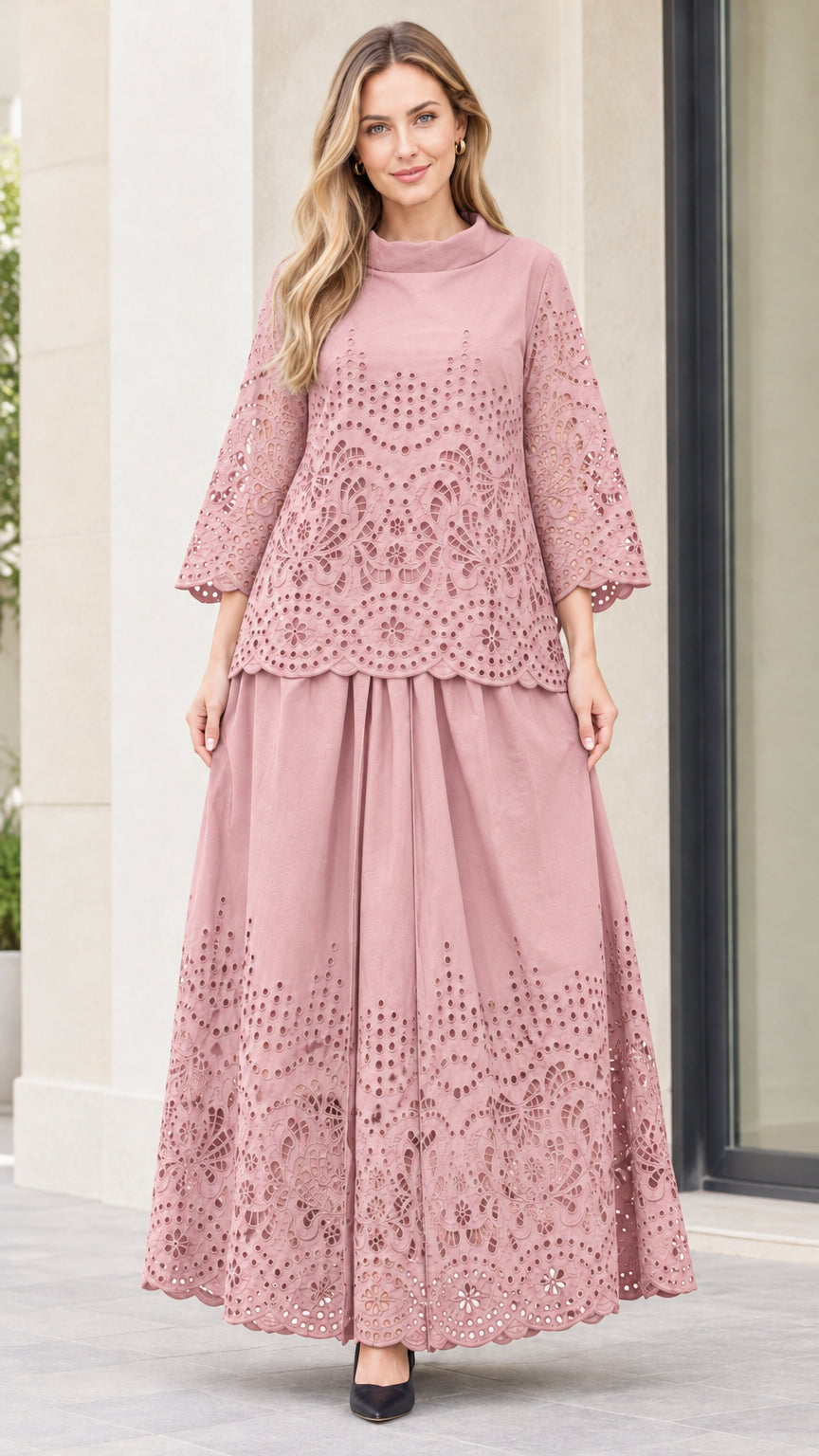 Front view of woman wearing dusty pink eyelet embroidered top and maxi skirt two-piece set