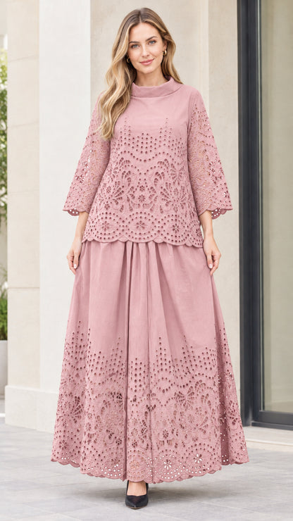 Front view of woman wearing dusty pink eyelet embroidered top and maxi skirt two-piece set
