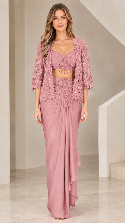 Front view of woman wearing Dusty Rose 3-piece beaded bustier and draped skirt set