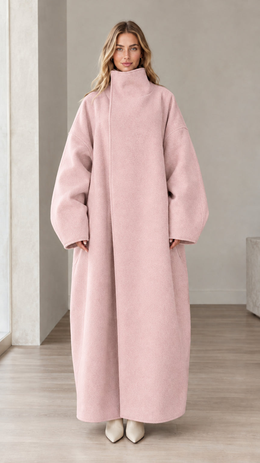 Front full view of woman wearing Blush Pink high neck oversized maxi coat