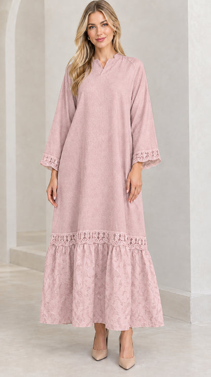 Front view of woman wearing dusty pink lace-trimmed tiered maxi dress