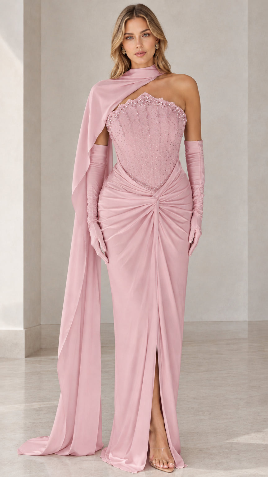 Full-length front view of blush pink embellished corset evening gown with cape and gloves