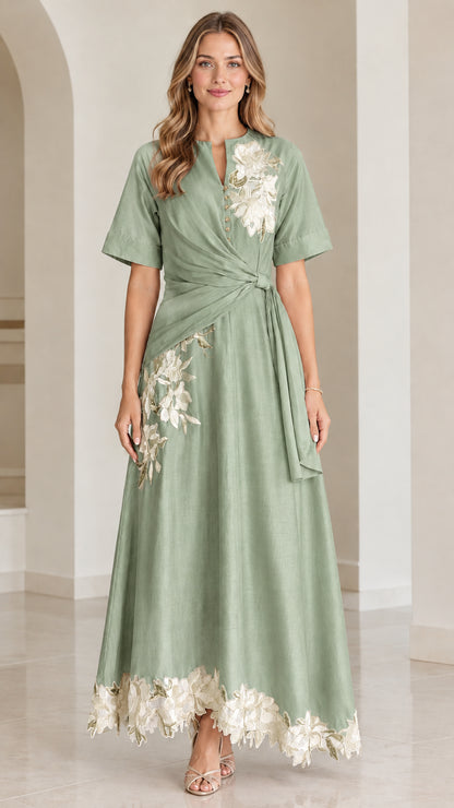 Front view of sage green floral embroidered twist-waist maxi dress