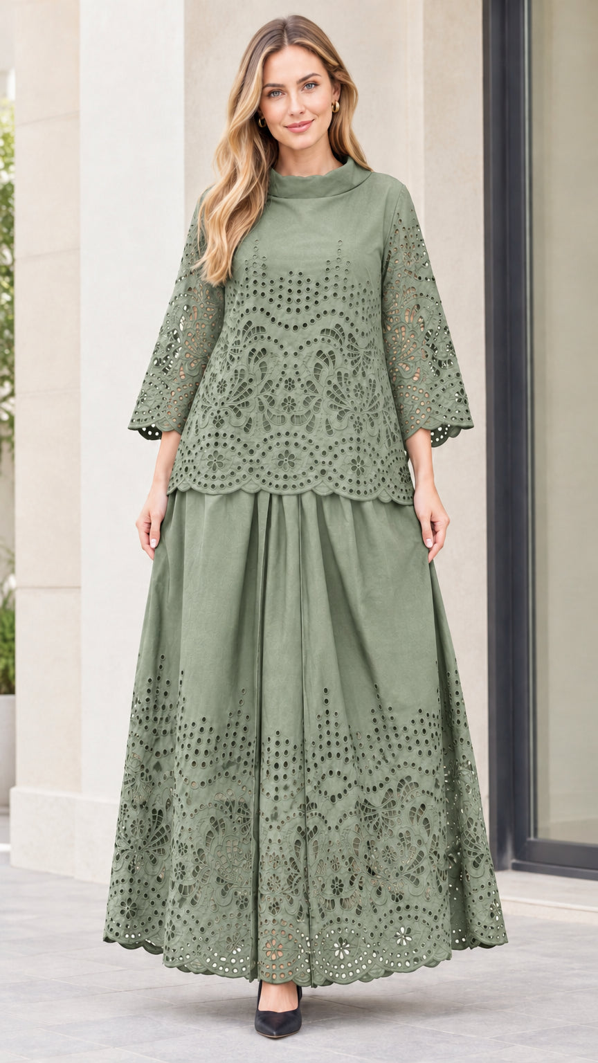 Front view of woman wearing sage green eyelet embroidered top and maxi skirt two-piece set