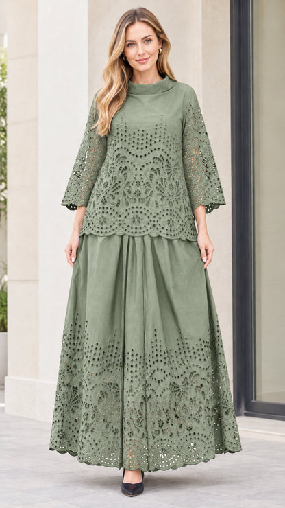 Front view of woman wearing sage green eyelet embroidered top and maxi skirt two-piece set