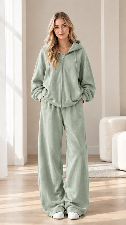 Woman wearing sage green zip-up hoodie and wide-leg sweatpants set