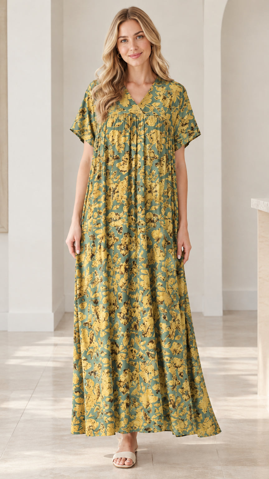 Model wearing olive green and yellow floral V-neck short sleeve maxi dress