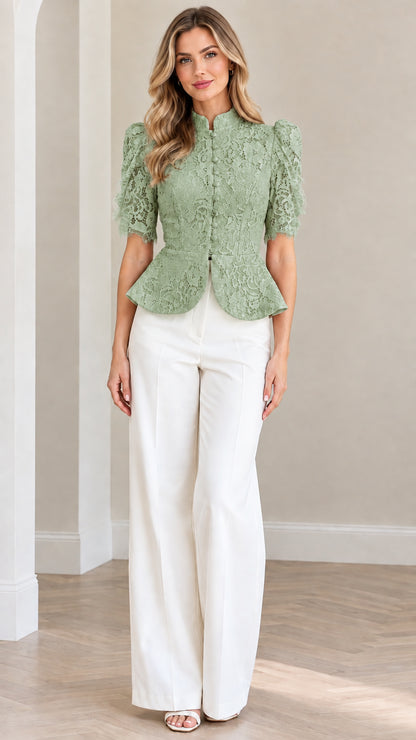 Model wearing sage green floral lace peplum blouse with white trousers