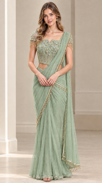 Full front view of sage green pre-draped saree set with beaded top