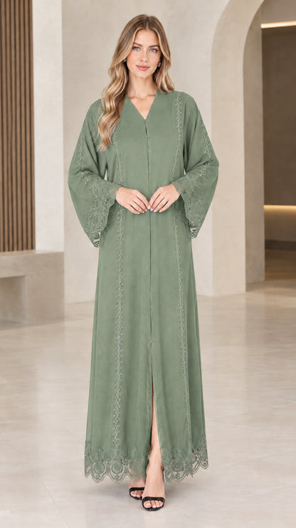 Front view of woman wearing sage green lace trim maxi abaya dress