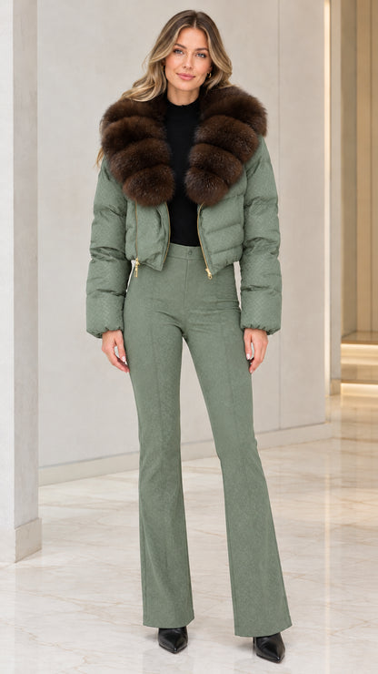 Model wearing sage green cropped puffer jacket with brown faux fur collar and matching green flared pants
