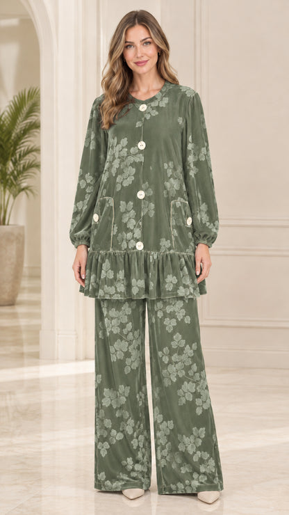 Front view of model wearing sage green floral embossed velvet tunic and wide leg pants set