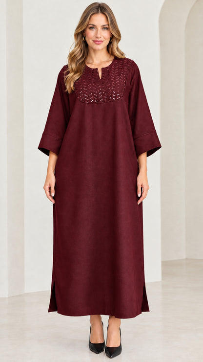 Front view of woman wearing burgundy wine red sequin kaftan maxi dress