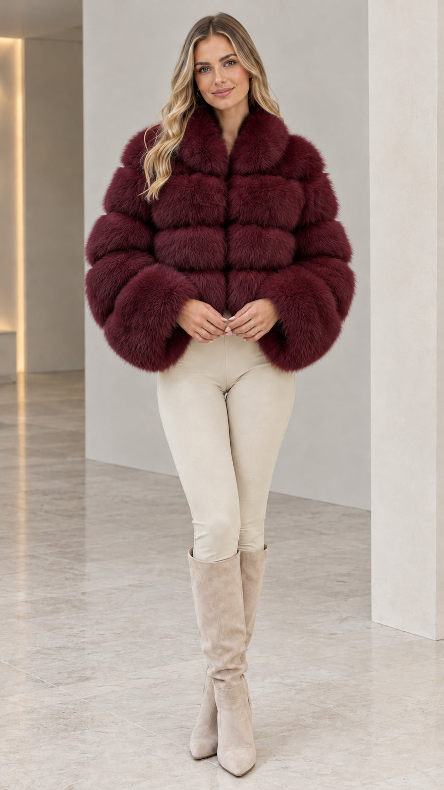 Model wearing deep burgundy wine cropped tiered faux fur jacket