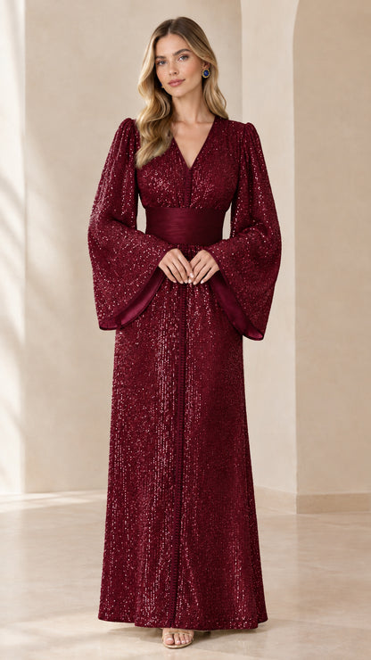Deep burgundy sequined floor-length formal dress with dramatic sleeves