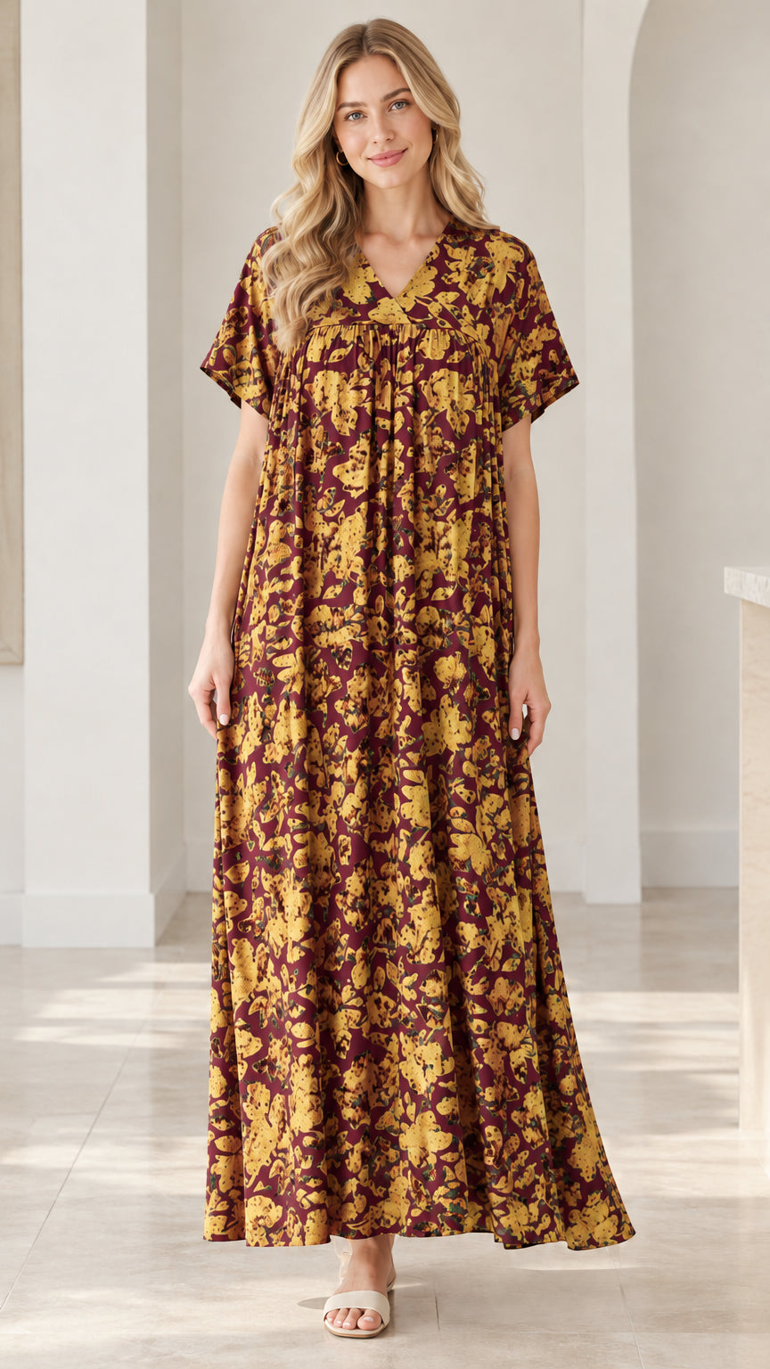Model wearing burgundy and yellow floral V-neck short sleeve maxi dress