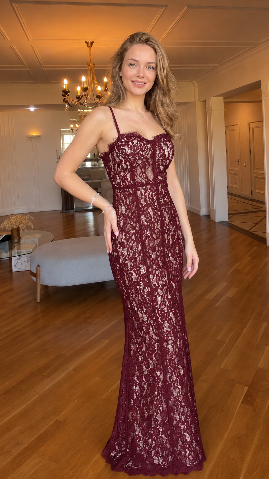 Woman wearing burgundy red floral lace corset maxi evening dress