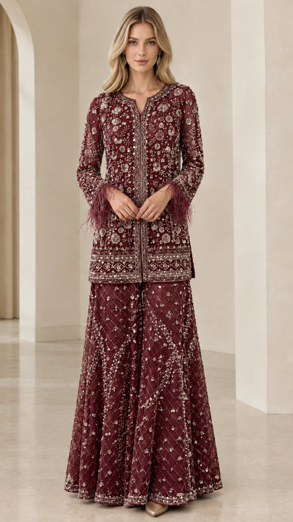 Model wearing burgundy wine embroidered tunic and palazzo two-piece ensemble