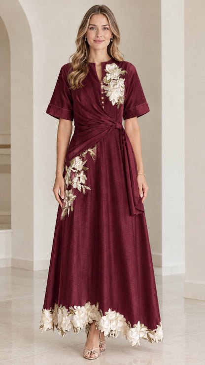 Front view of burgundy floral embroidered twist-waist maxi dress