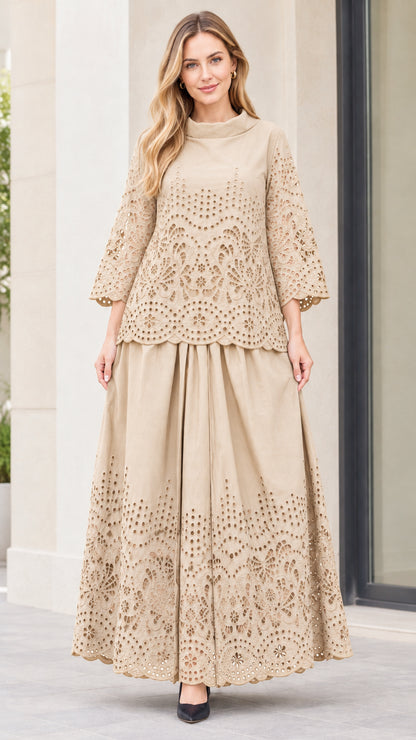 Front view of woman wearing beige eyelet embroidered top and maxi skirt two-piece set
