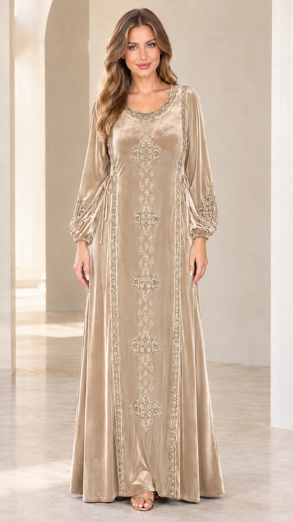 Front view of model wearing champagne beige embroidered velvet maxi dress