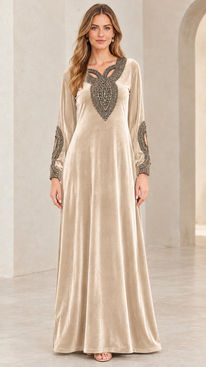 Model wearing Champagne gold velvet embellished long sleeve maxi dress
