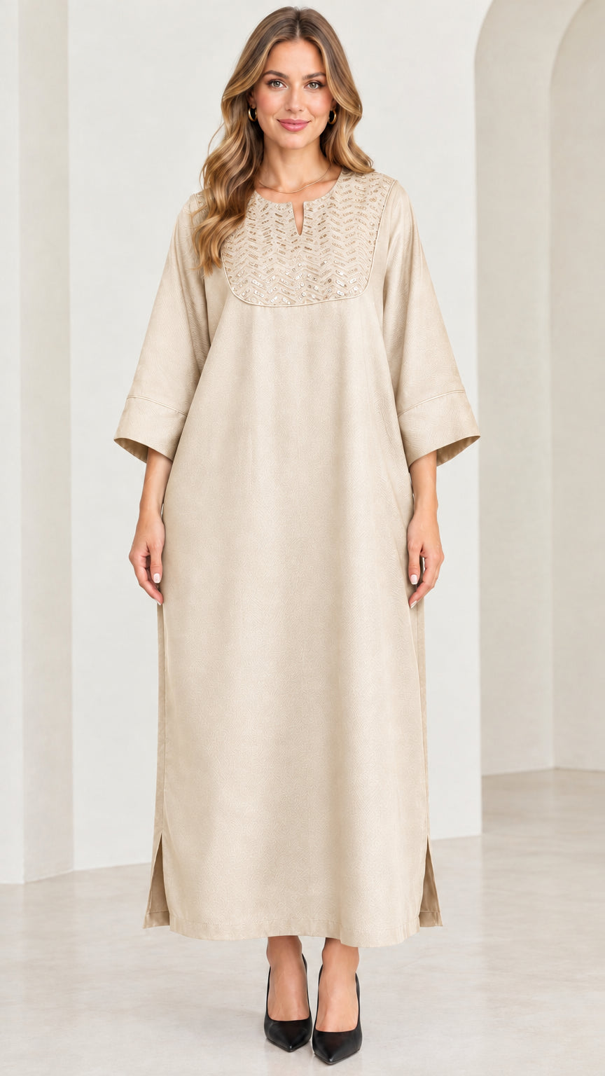 Front view of woman wearing beige champagne sequin kaftan maxi dress