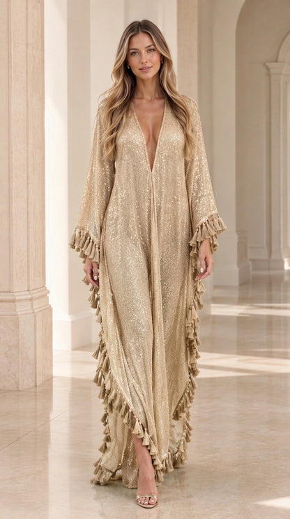 Woman wearing champagne gold sequin fringe maxi caftan gown