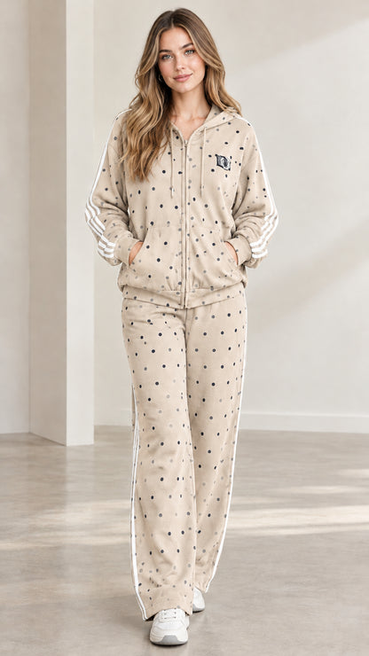 Model wearing oatmeal beige polka dot hooded tracksuit set with white side stripes
