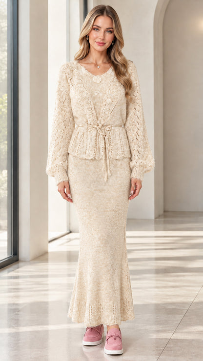 Woman wearing cream beige openwork knit peplum top and fluted maxi skirt set