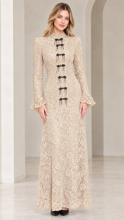 Front view of model wearing champagne beige floral lace maxi gown